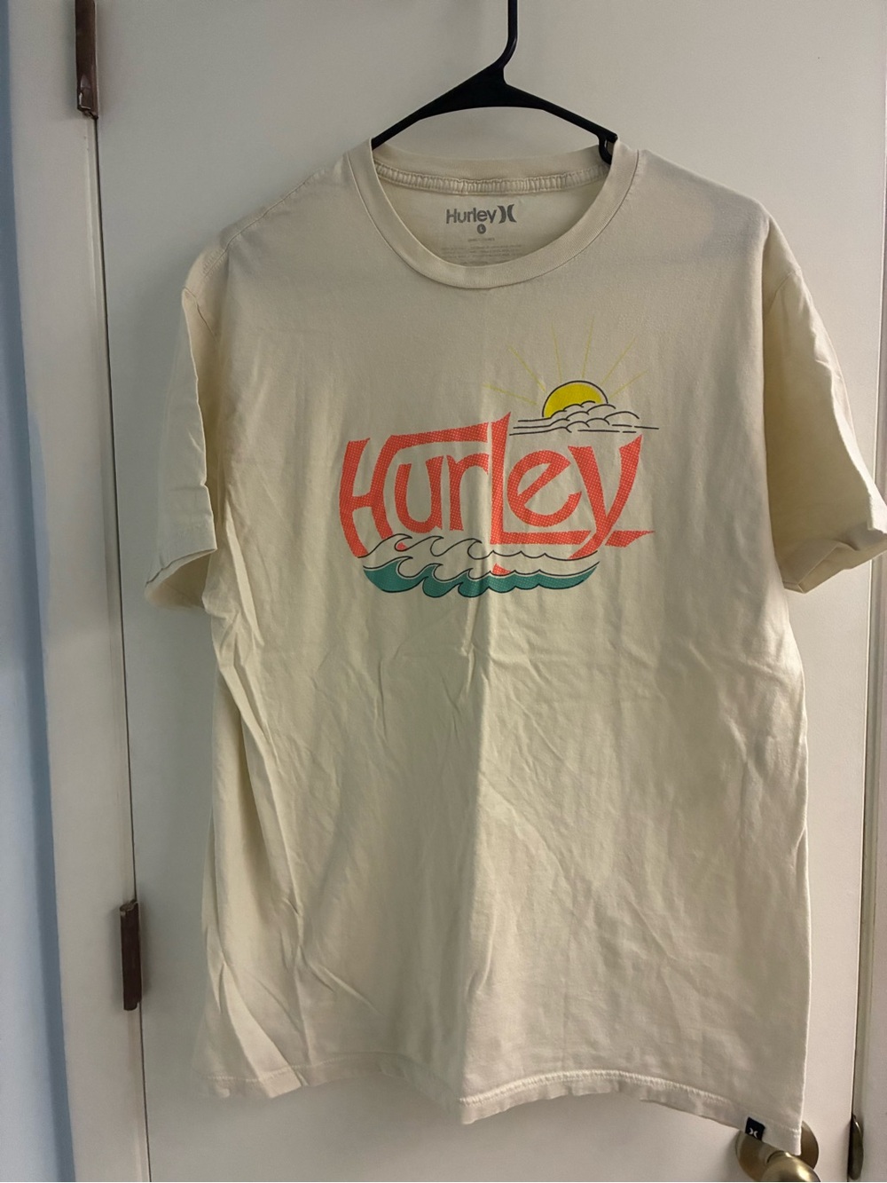 Hurley Cream Tee with Coral Logo and Teal Wave Graphic